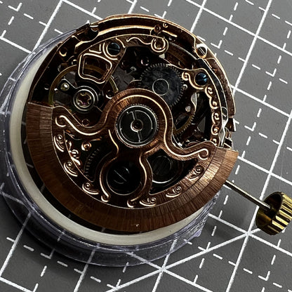 Hollow rose gold watch with mechanical movement, 4 subdials, and 7 hands detailed design