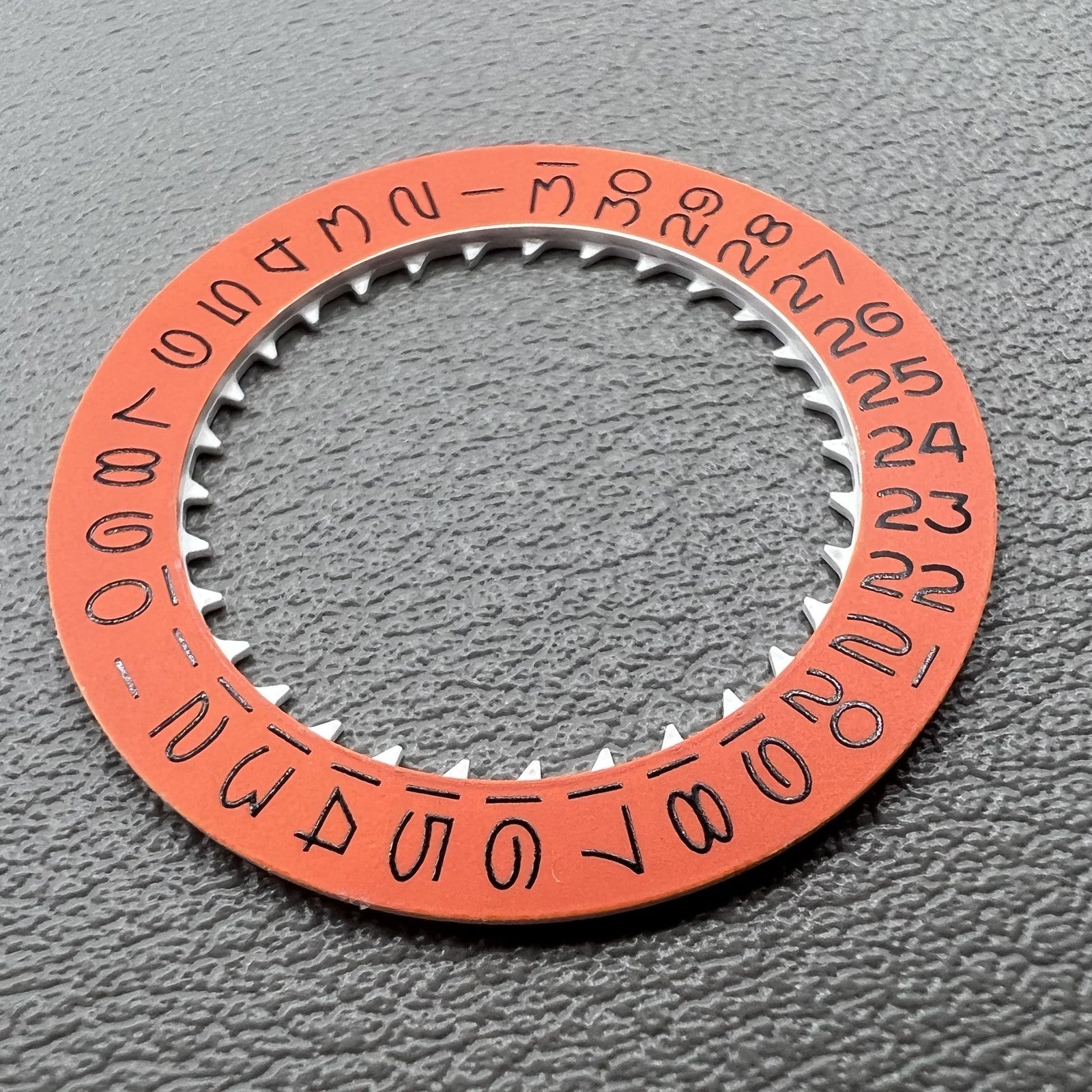Vintage orange date wheel disk for NH35 NH36 movement, enhancing Seiko watch accuracy and classic style.
