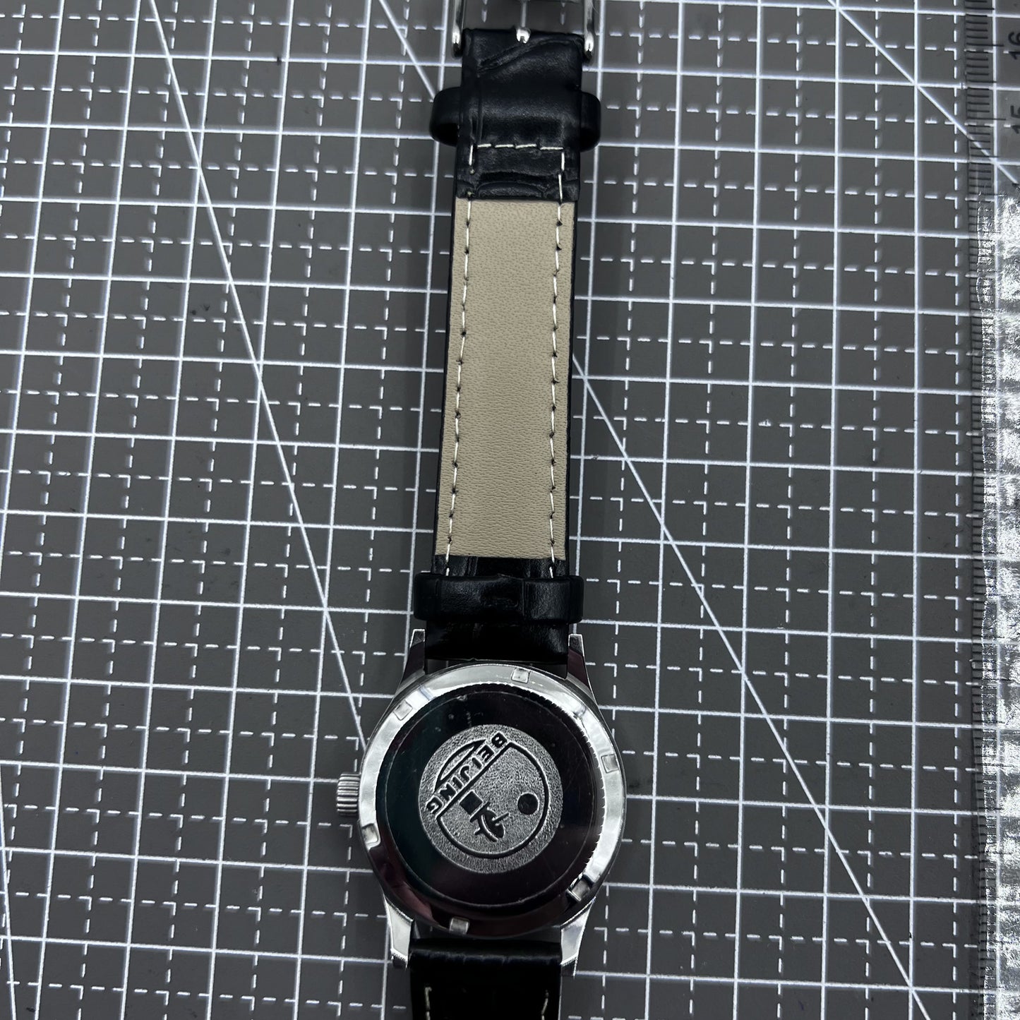 Beijing 31mm mechanical watch with black double rhomb strap, silver case, and classic three-hand design.