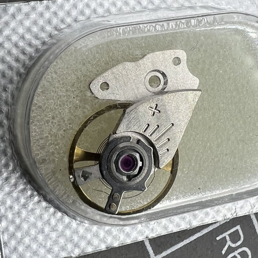 Original Miyota 9015 watch balance wheel with splint, precision Japanese movement component for watch repair.