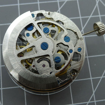 Silver hollow balance wheel watch movement by SL1911, showcasing intricate automatic mechanical design.