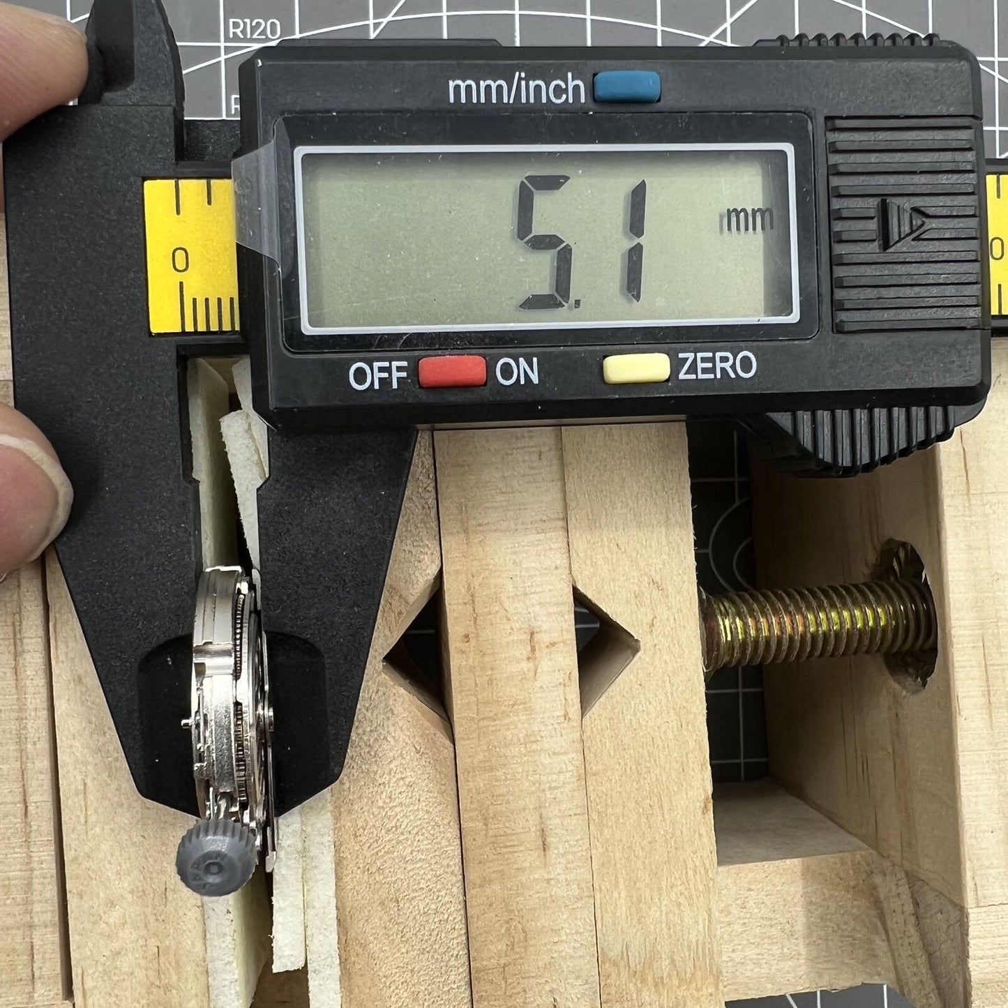 Miyota/Citizen 82S7 silver plated automatic watch movement showcasing precise mechanical craftsmanship.