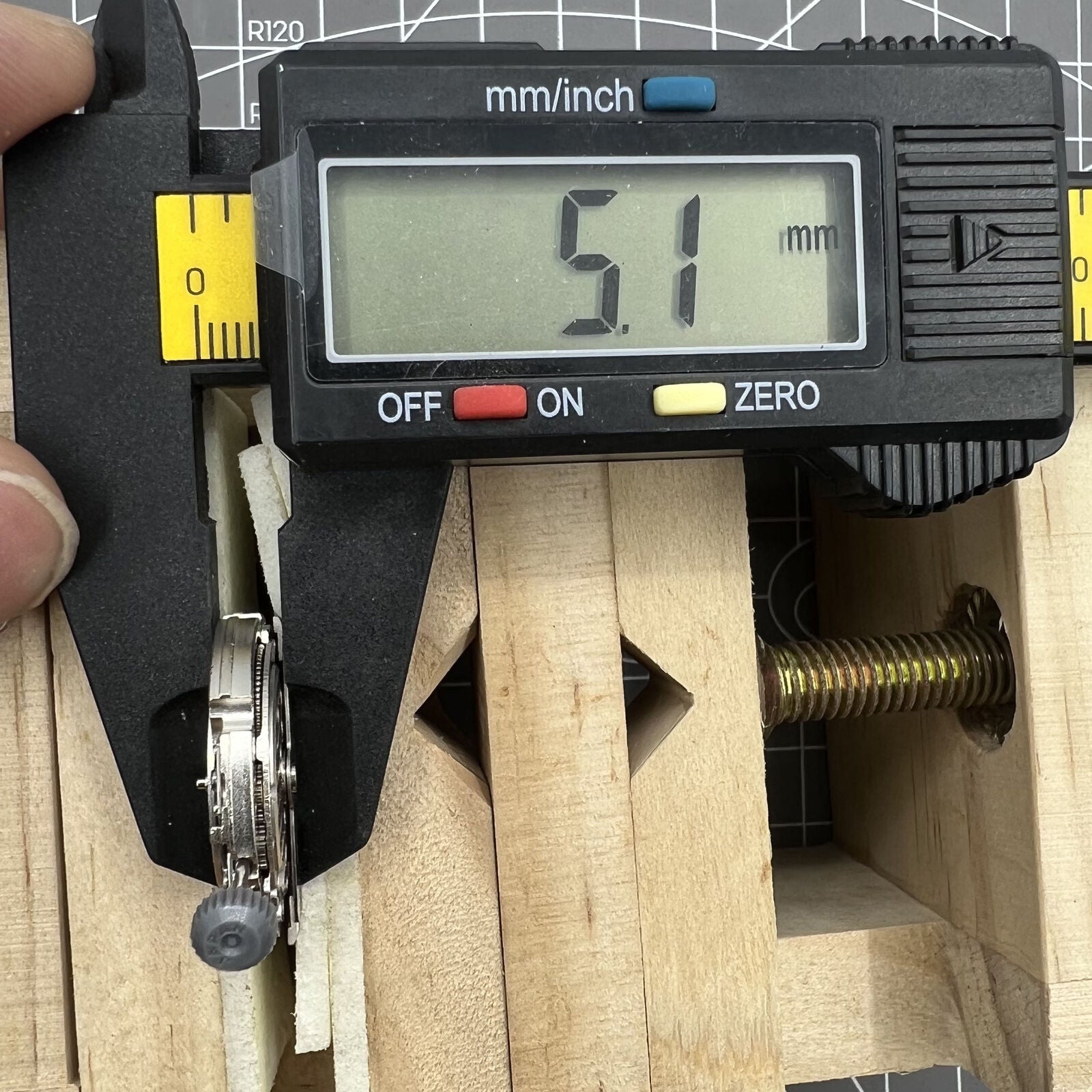 Miyota/Citizen 82S7 silver plated automatic watch movement showcasing precise mechanical craftsmanship.