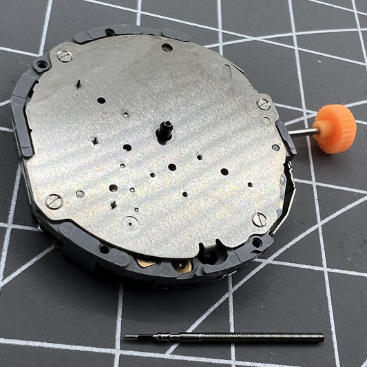 Japan Made Miyota JS55 watch movement with small second hand at 7 o'clock, precise quartz mechanism.
