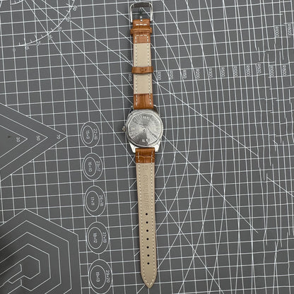 33mm Chunlan manual steel watch with silver dial, 17-jewel movement, and sleek stainless steel band.