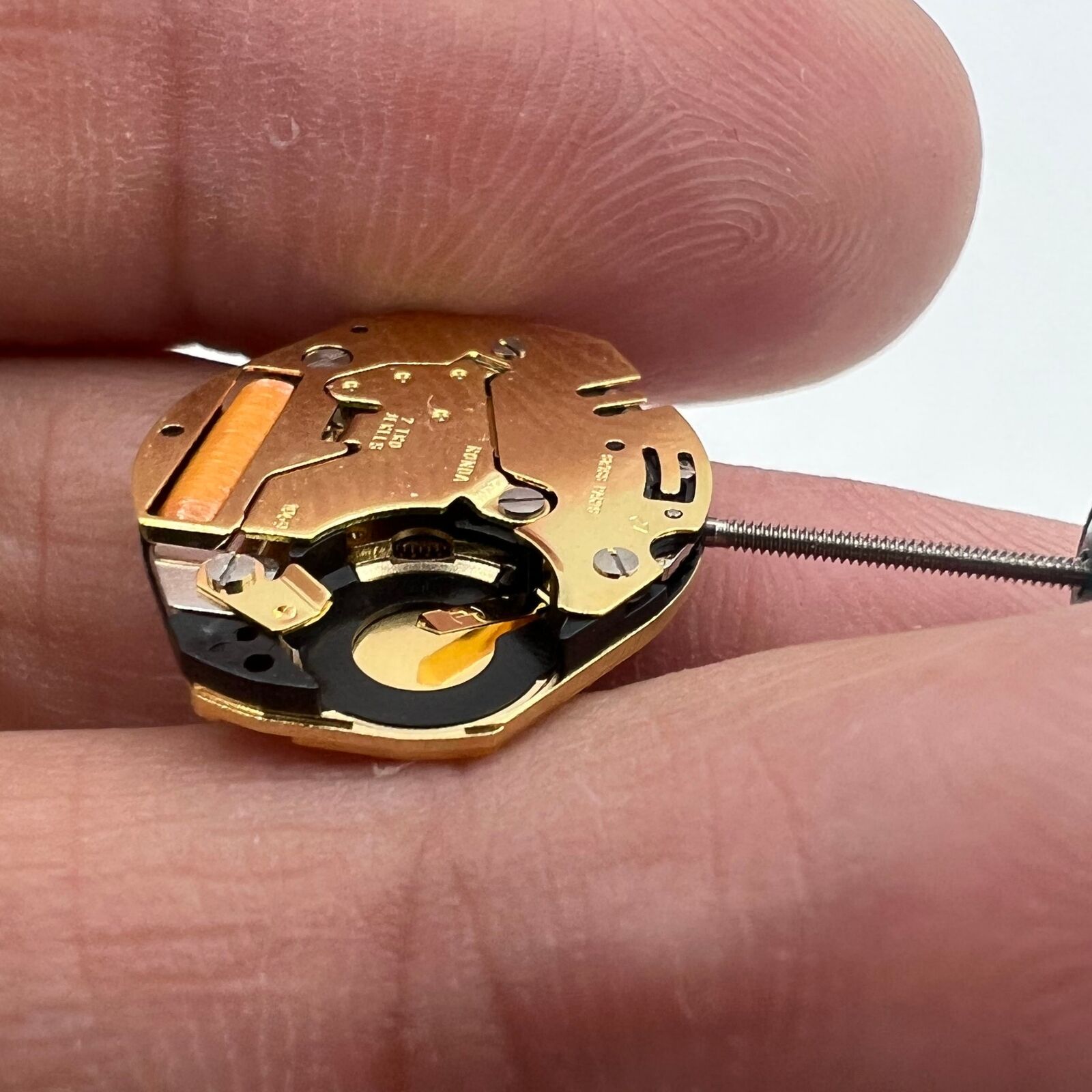 Ronda 1069 Swiss made golden plated quartz watch movement for precise timekeeping.