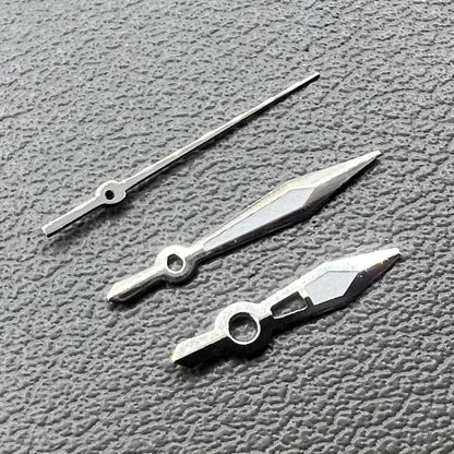 Silver-trimmed green lume arrow hands set for Ronda 515, ideal watch upgrade parts.