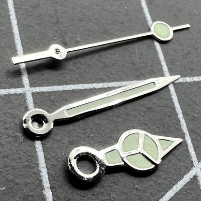 Silver trim green lume watch hands set for Miyota 2035 movement, luminous and precise timing.