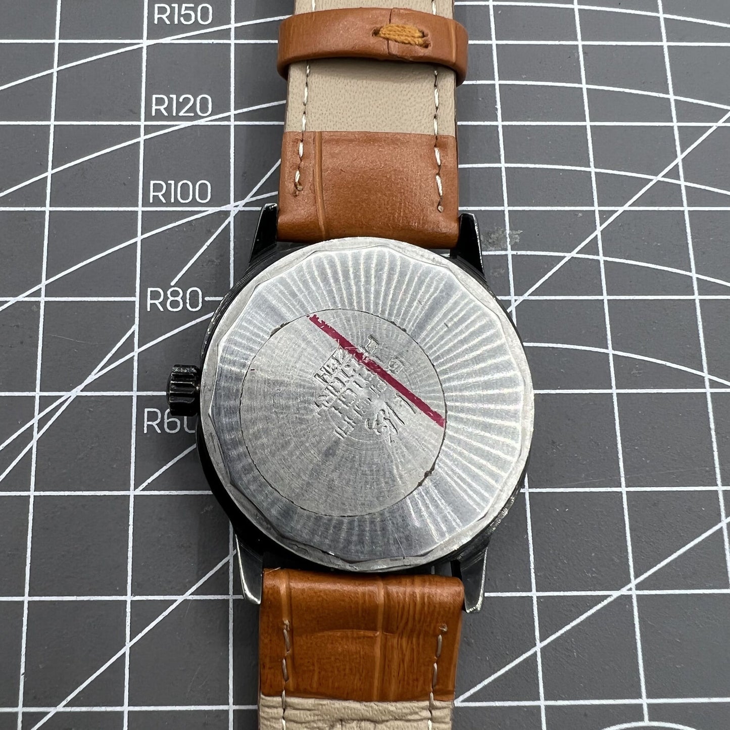 Shanghai Factory 34mm manual mechanical watch with black dial, 19 jewels, shock-resistant design for precise timekeeping.