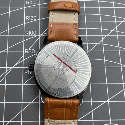 Shanghai Factory 34mm manual mechanical watch with black dial, 19 jewels, shock-resistant design for precise timekeeping.