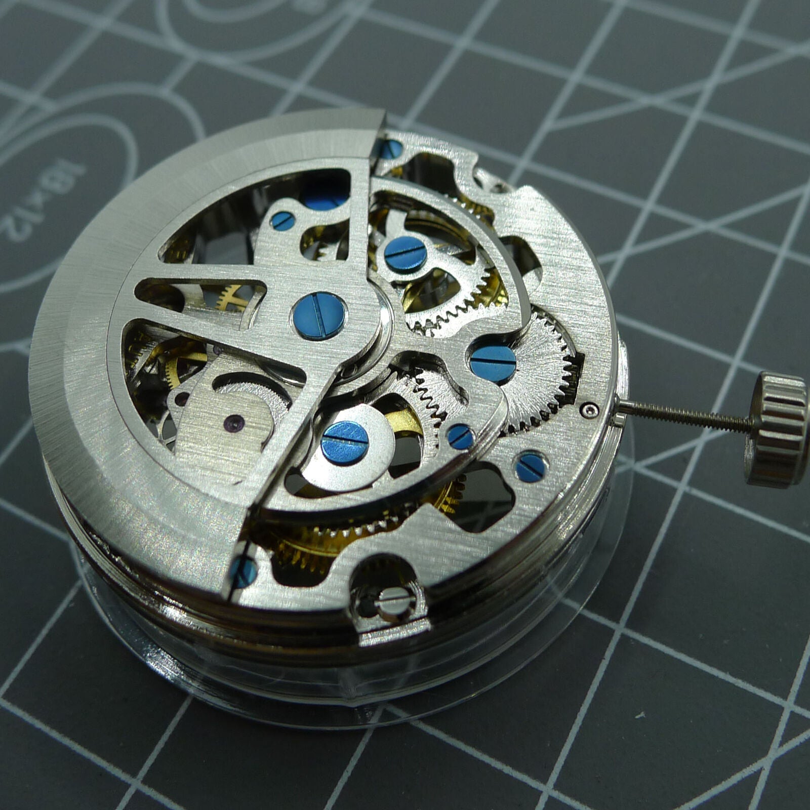 SL1911 Silver hollow balance wheel showcasing automatic mechanical movement in watch accessory.