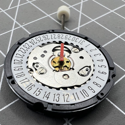ISA 307 quartz watch movement showing date at 6, brand new old stock for accurate timekeeping.