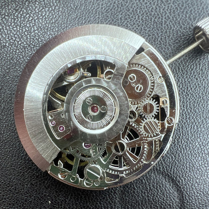 Tianjin Automatikwerk watch mechanism with 24 jewels, hand-engraved silver hollow design for premium watch accessories.