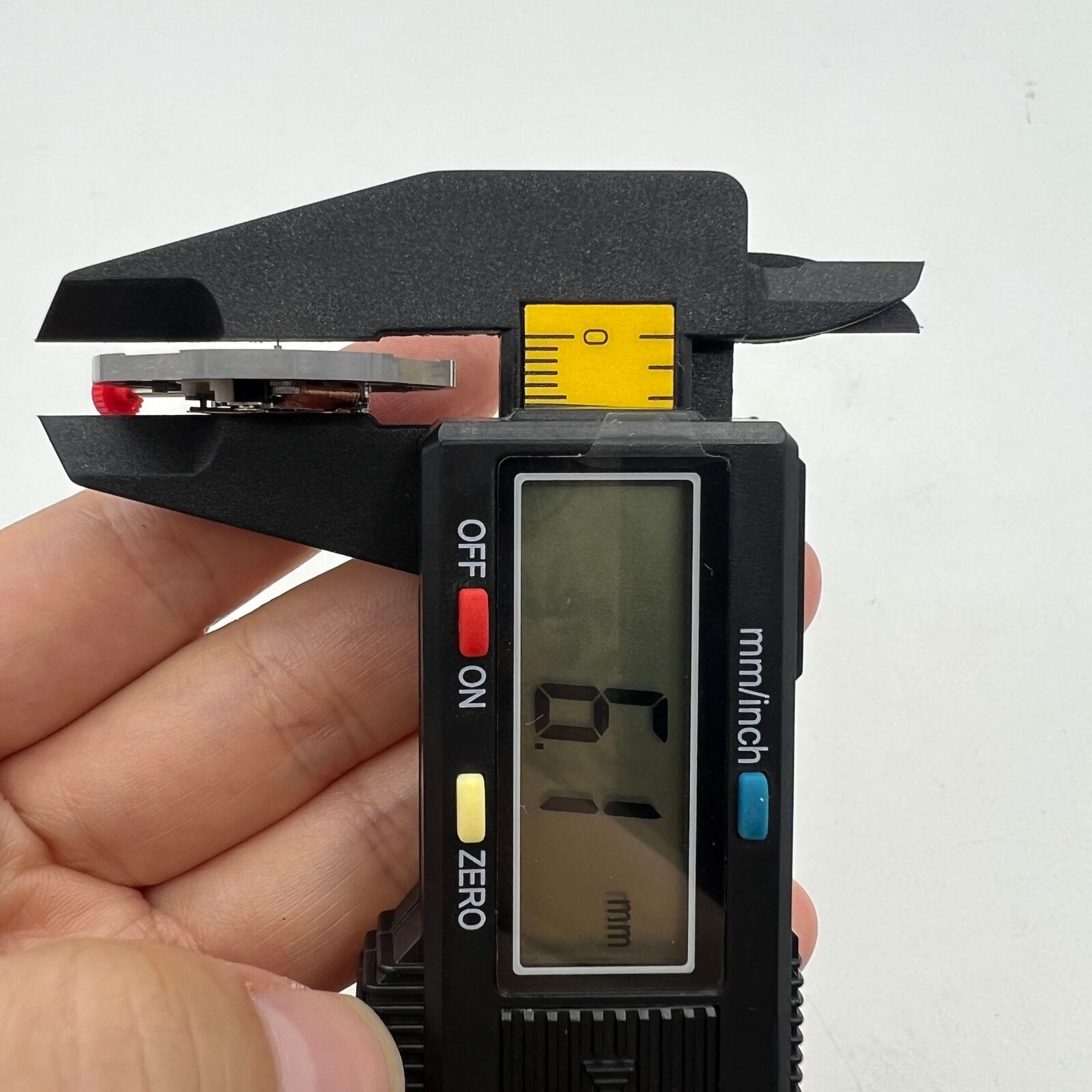 Miyota 2415 quartz movement with black date disk at 3 o'clock, precision Japan-made watch part.