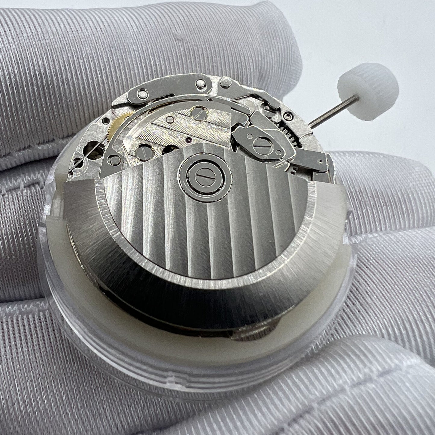 Close-up of China-made 7753 mechanical 1:1 movement clone for Daytona watch accessories, precision-engineered.