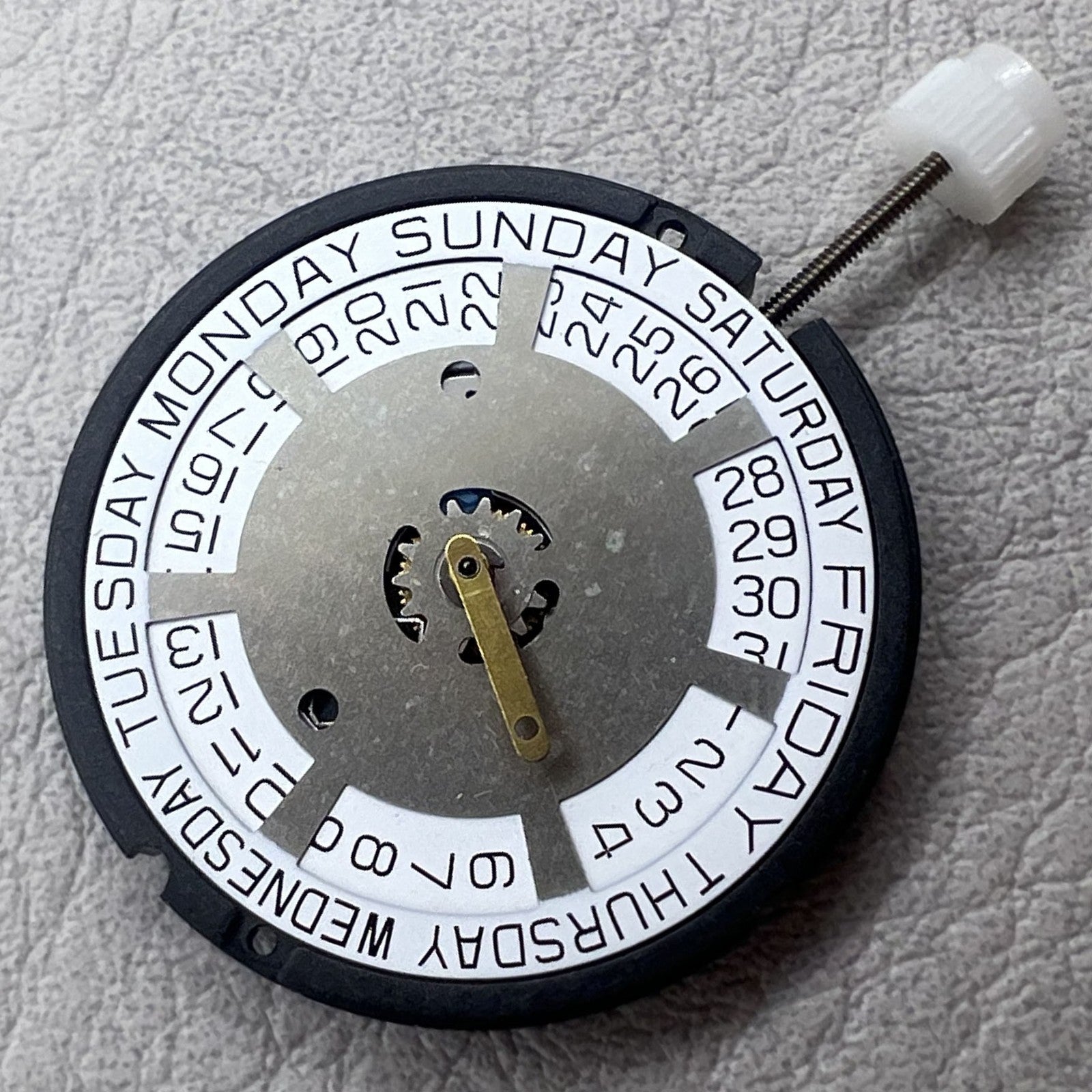 Swiss ETA 805 144 quartz movement watch with silver three hands and white dial, precise timekeeping.