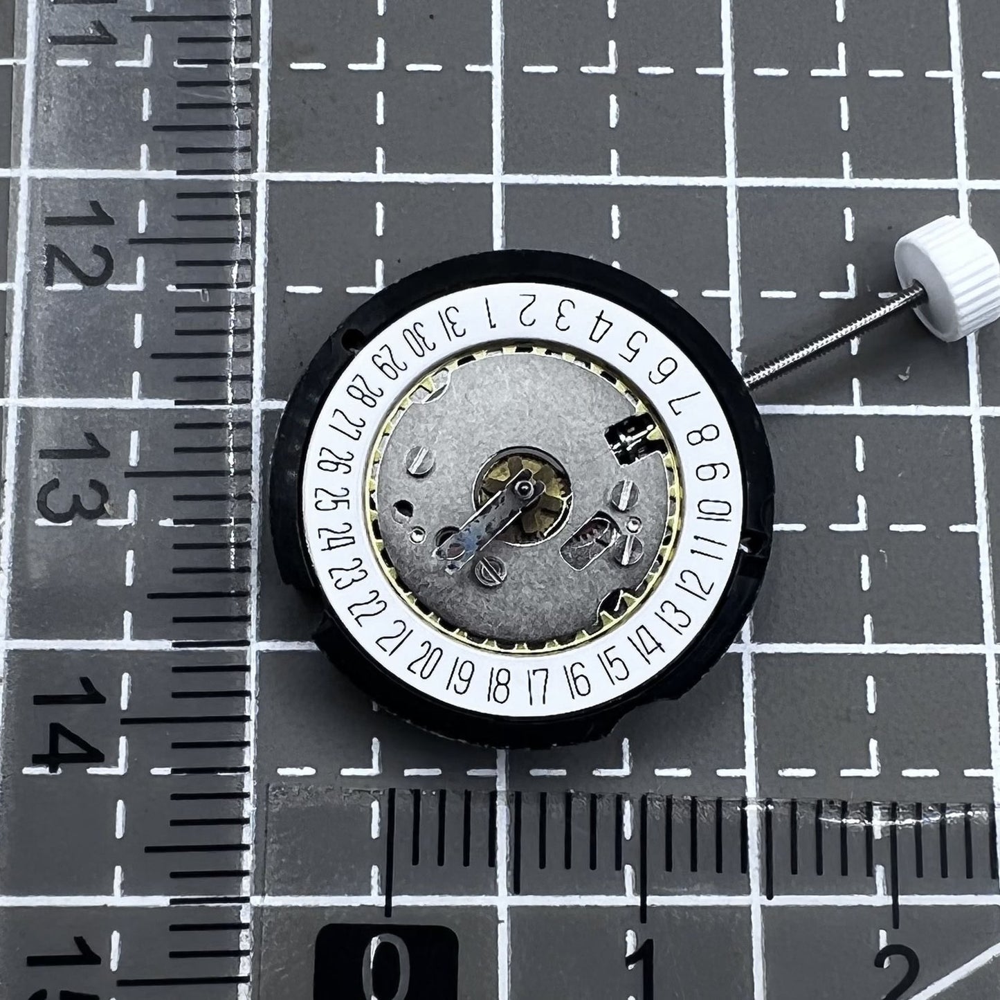 Ronda 585 Swiss quartz watch movement with date at 6 o'clock, precision timekeeping.