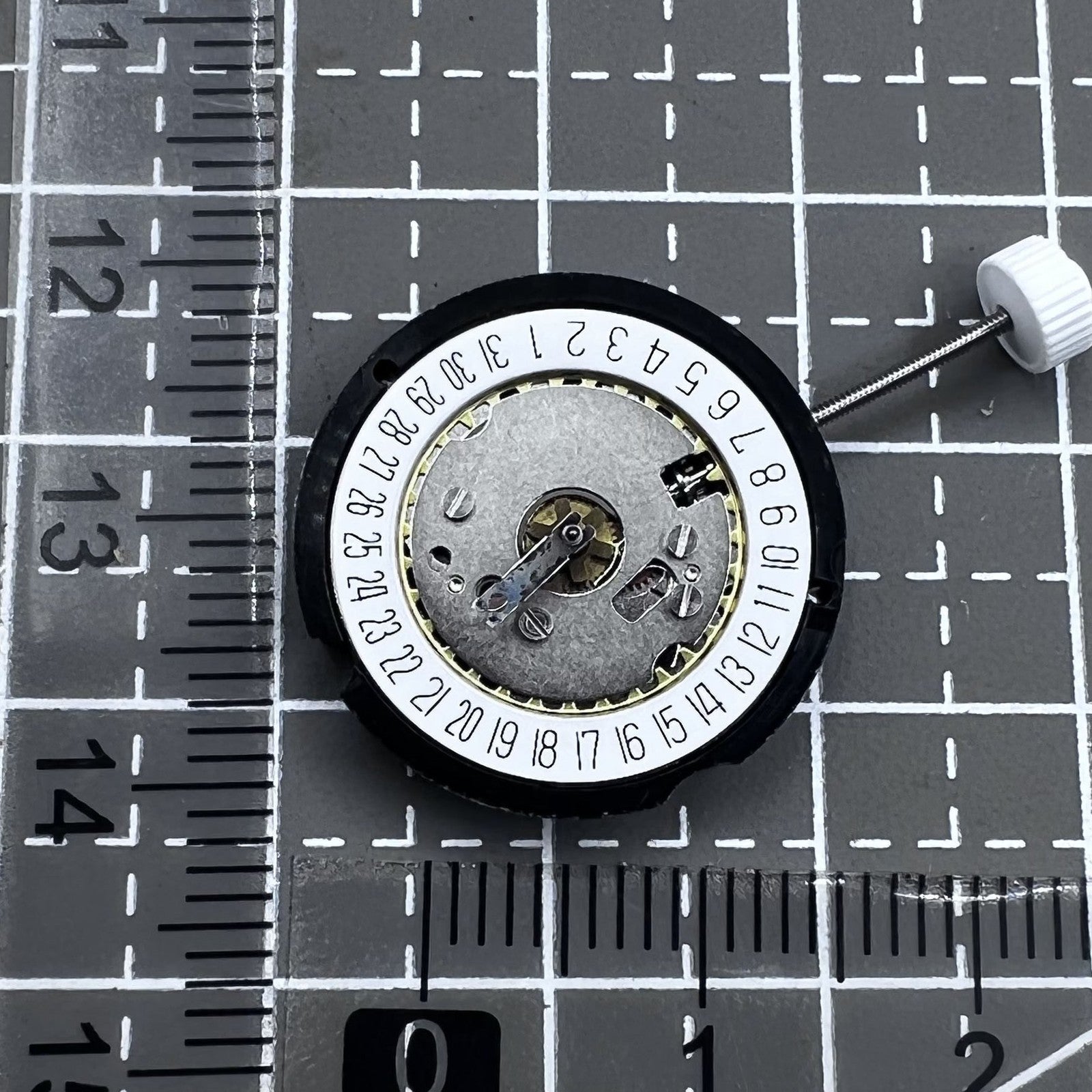 Ronda 585 Swiss quartz watch movement with date at 6 o'clock, precision timekeeping.