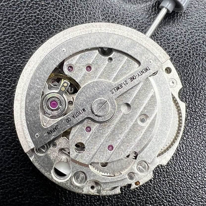 Miyota 8217 automatic watch movement displaying three hands with small seconds at 9 o'clock, precision gear mechanism.