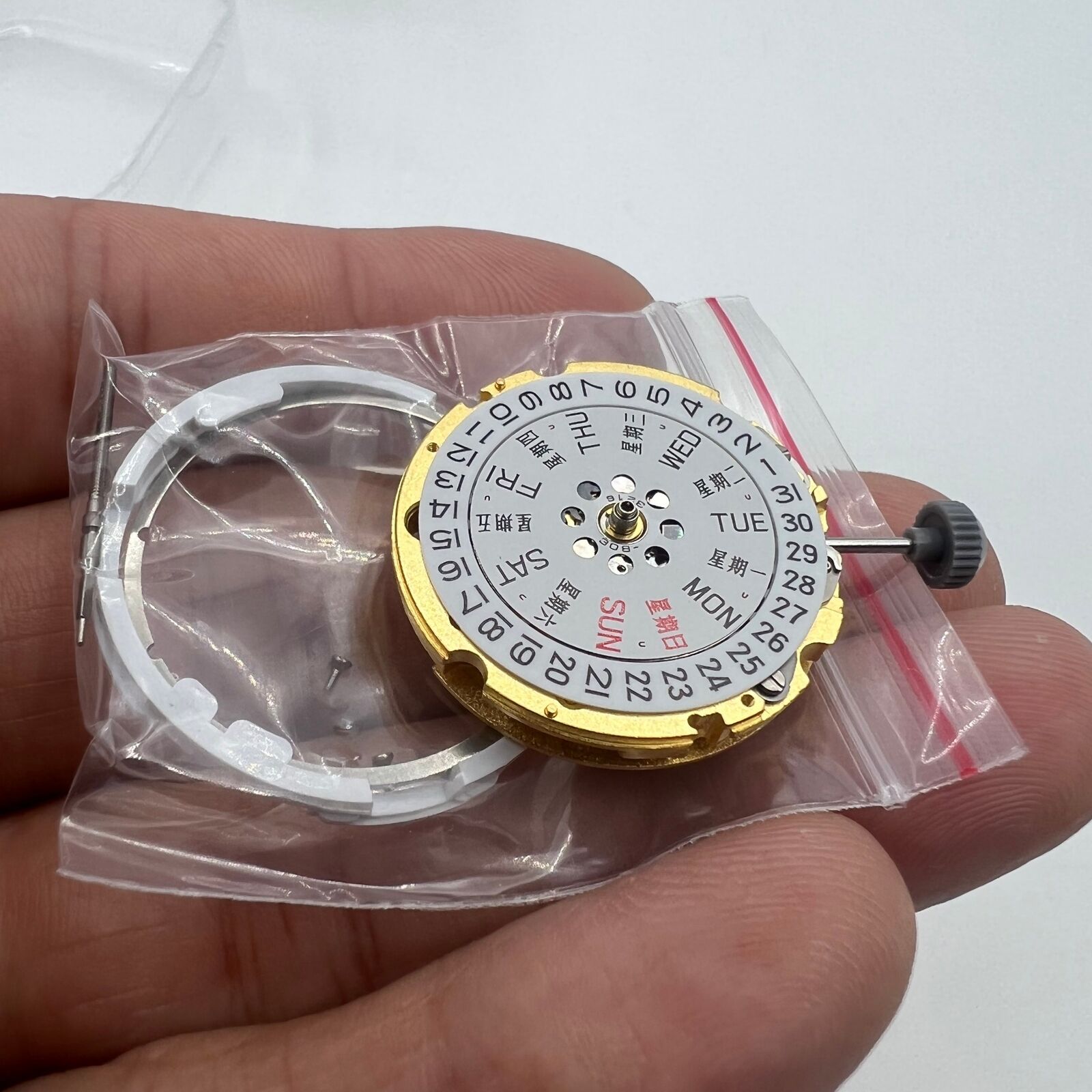 Golden Miyota Citizen 8200 automatic watch movement displaying day and date functions for precision timekeeping.