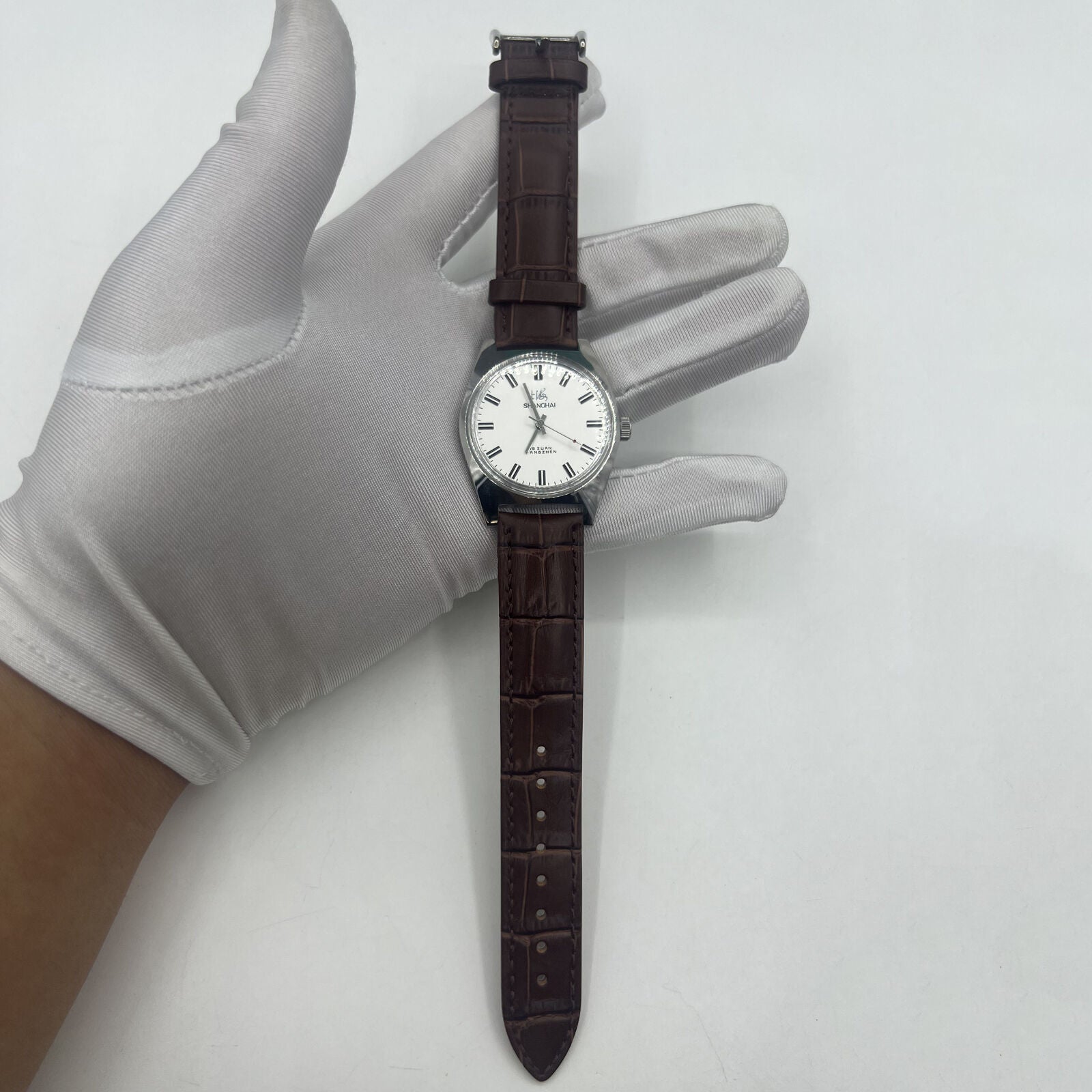 Shanghai Factory 38mm manual mechanical watch with white dial, 3 hands, 19 jewels, classic design.