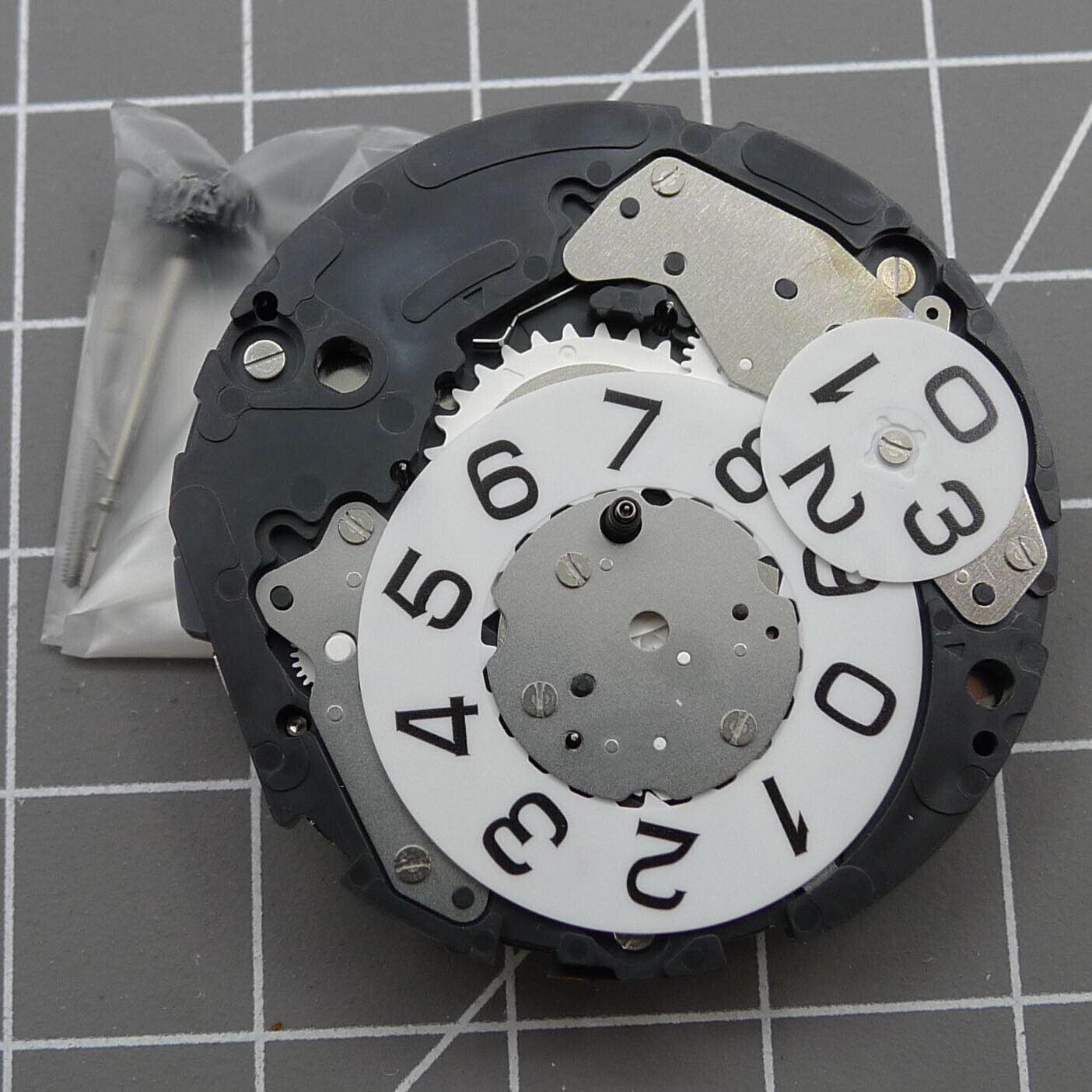 Miyota 6S50 quartz watch movement showing date at 12, small seconds at 3, 6, and 9 positions