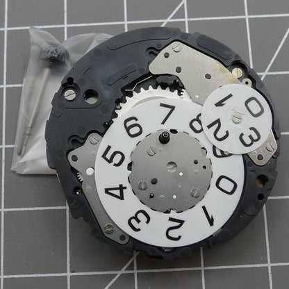 Miyota 6S50 quartz watch movement showing date at 12, small seconds at 3, 6, and 9 positions