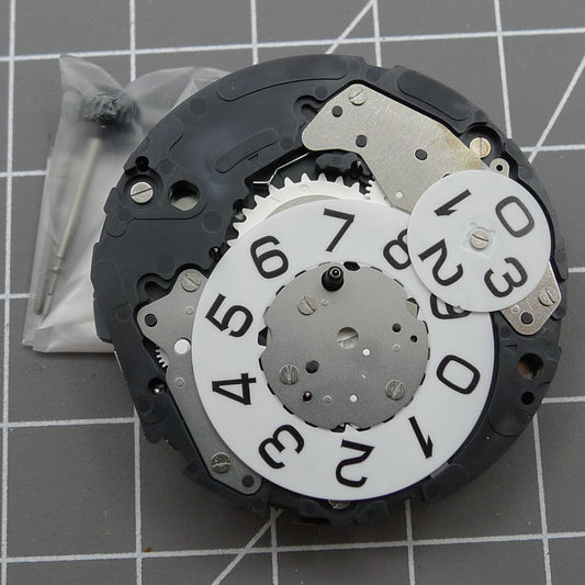 Miyota 6S50 quartz watch movement showing date at 12, small seconds at 3, 6, and 9 positions