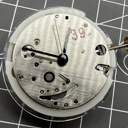 Dandong 7750 automatic watch movement with small seconds at 6 o'clock, ultra-thin design.