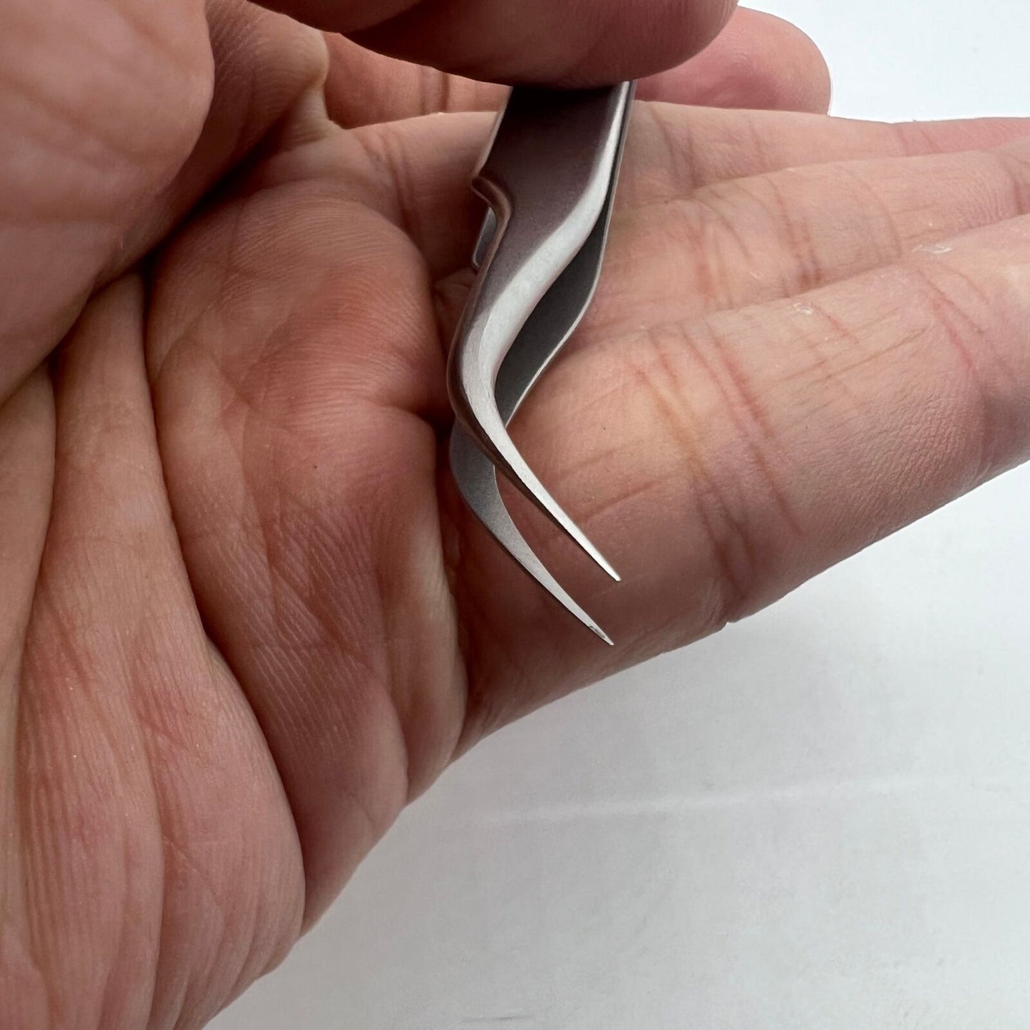 Swiss Bergeon 7026-7 fine curved antimagnetic tweezers, 110mm, perfect for precise watch repair tasks.