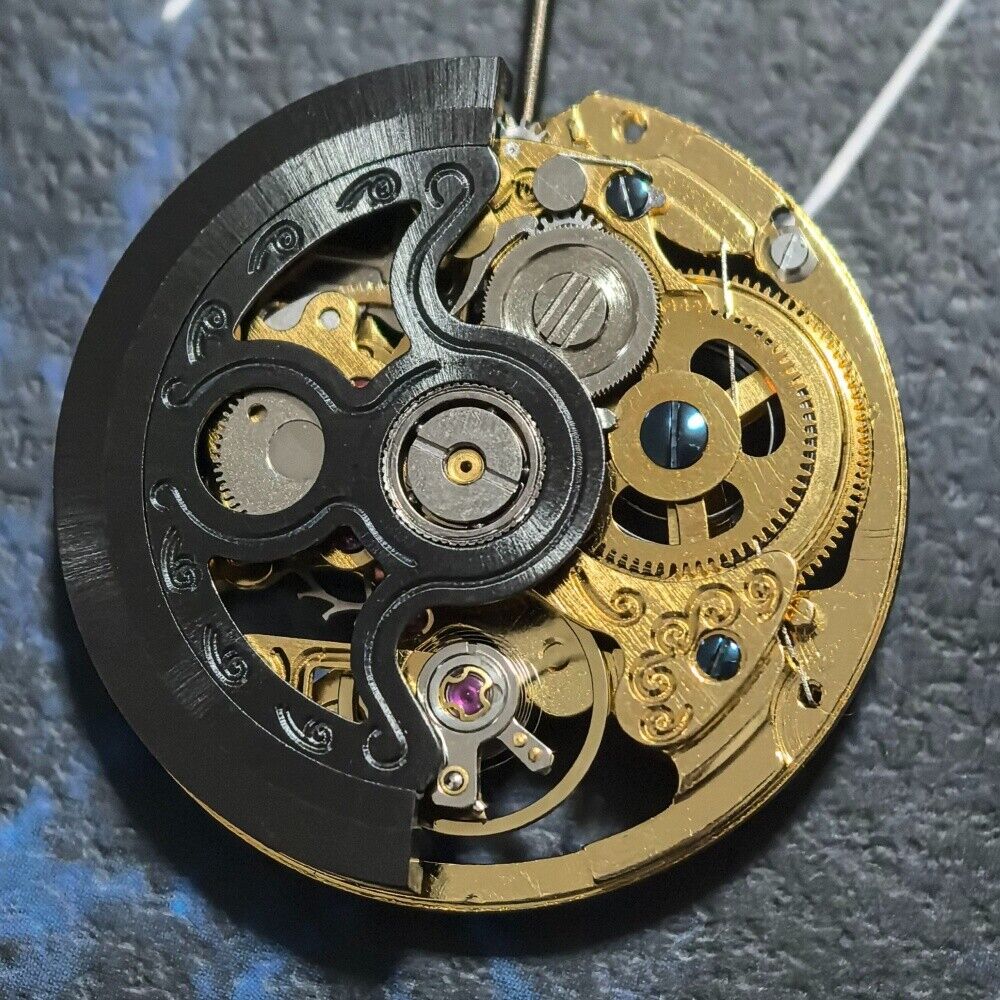 Golden hollow automatic mechanical watch part with black rotor, precision movement by China Made for repairs.