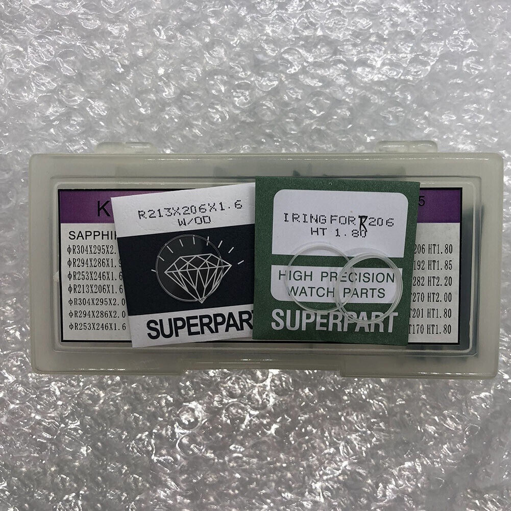 Rolex watch parts set with 15 sapphire sizes and 18 I-Rings, 69-piece repair kit in storage box.