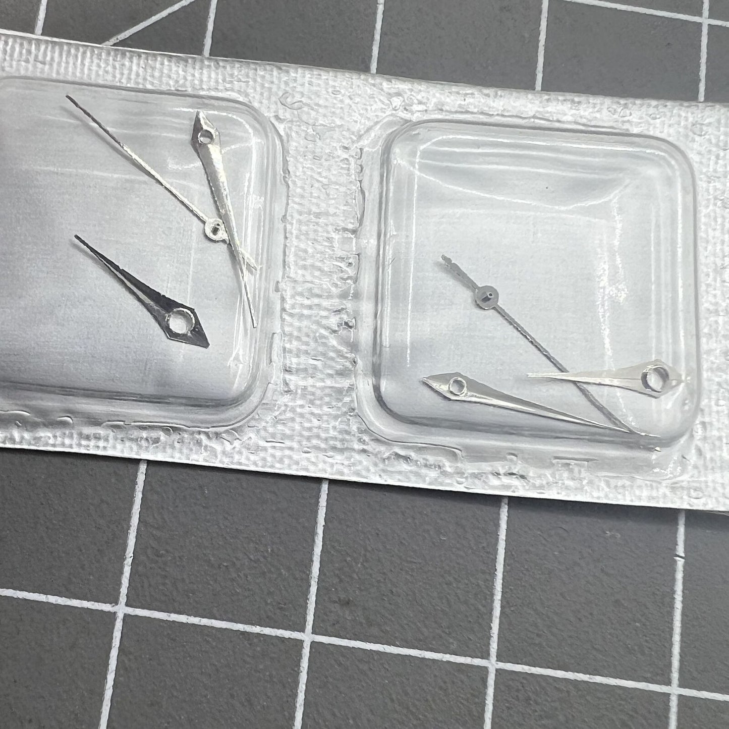 Silver 15mm arrow-shaped watch hands set for Miyota 2035 movement, precision design.