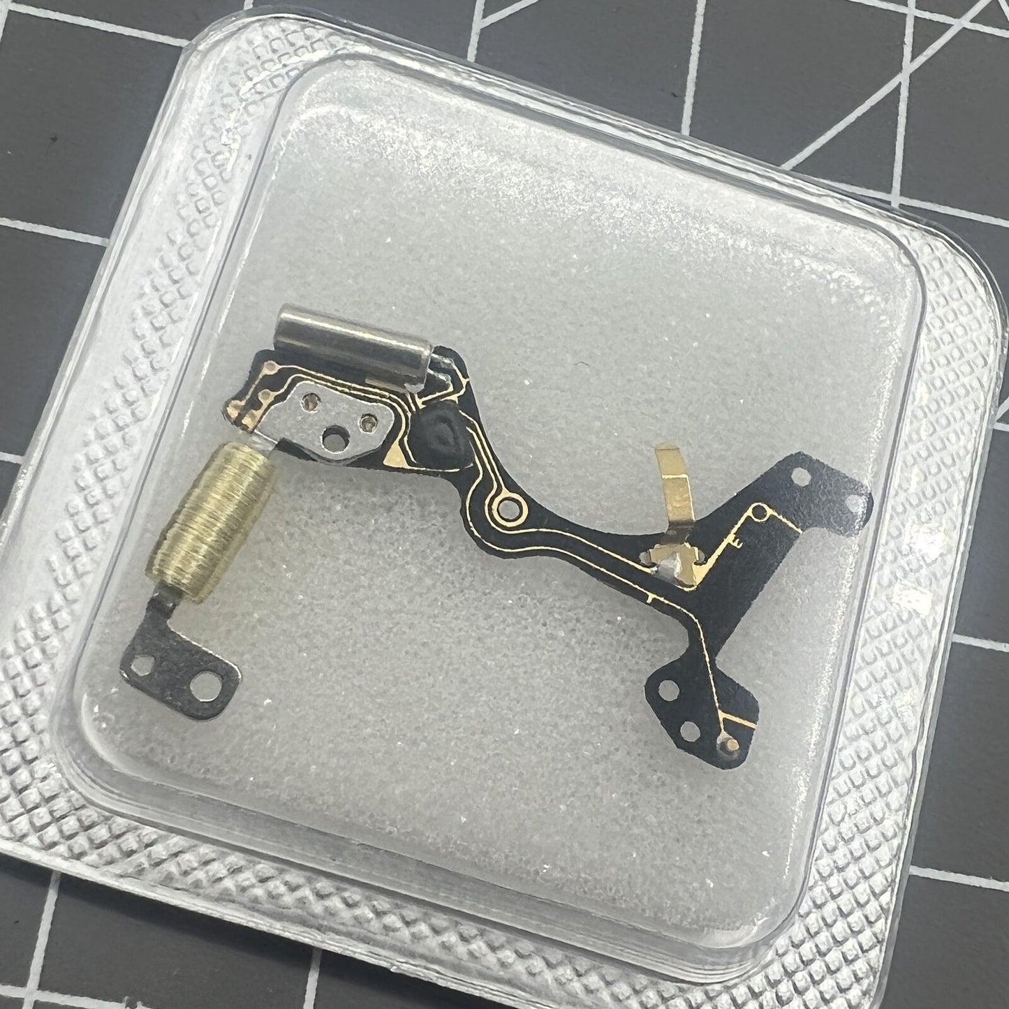 Brand new Ronda 7004.N circuit board for watch repair, improving movement precision and durability.