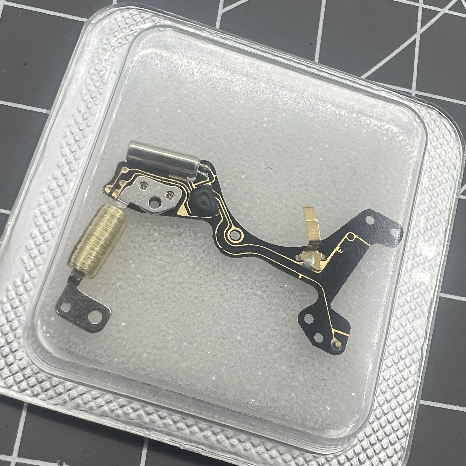 Brand new Ronda 7004.N circuit board for watch repair, improving movement precision and durability.