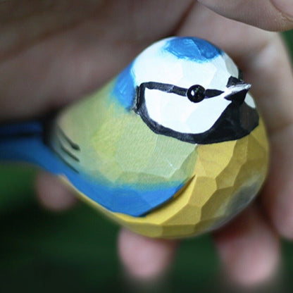 Handcrafted Blue Tit wooden figurine, detailed bird sculpture for charming home decor.