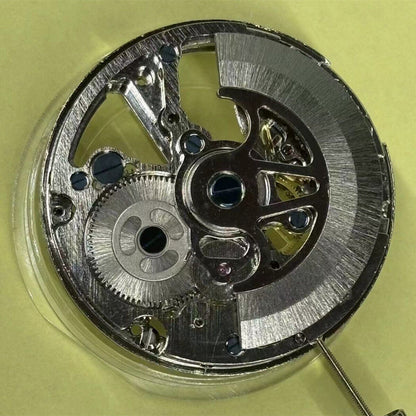 Hollow automatic mechanical watch part with moon phase at 12, precise timekeeping by China Made.