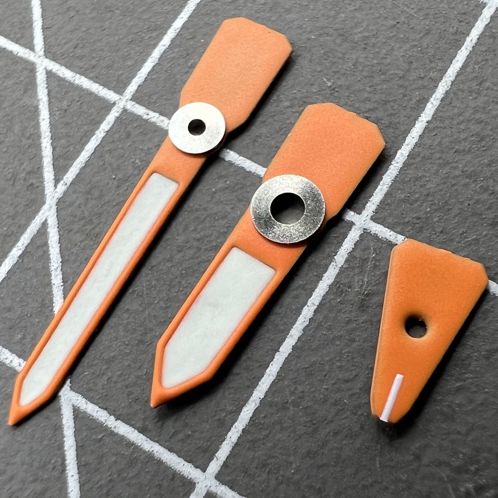 Orange luminous enamel watch hands for Casioak GA2100 GAB2110, vibrant C3 glow, precise detailing.