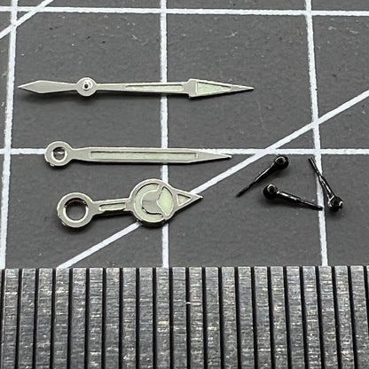 Black 12mm watch hands with silver trim and green luminous finish for Miyota 0S60, ideal for precise timekeeping.