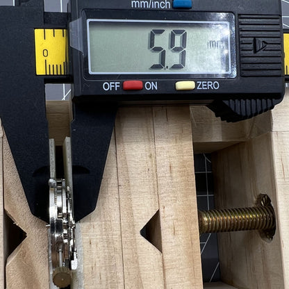 DANDONG 26.5mm hollow silver automatic watch movement displaying detailed gears and precise mechanics.