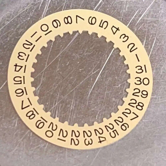 Golden date wheel with date at 3 o'clock, compatible with 3135 movement, ideal for watch repairs.