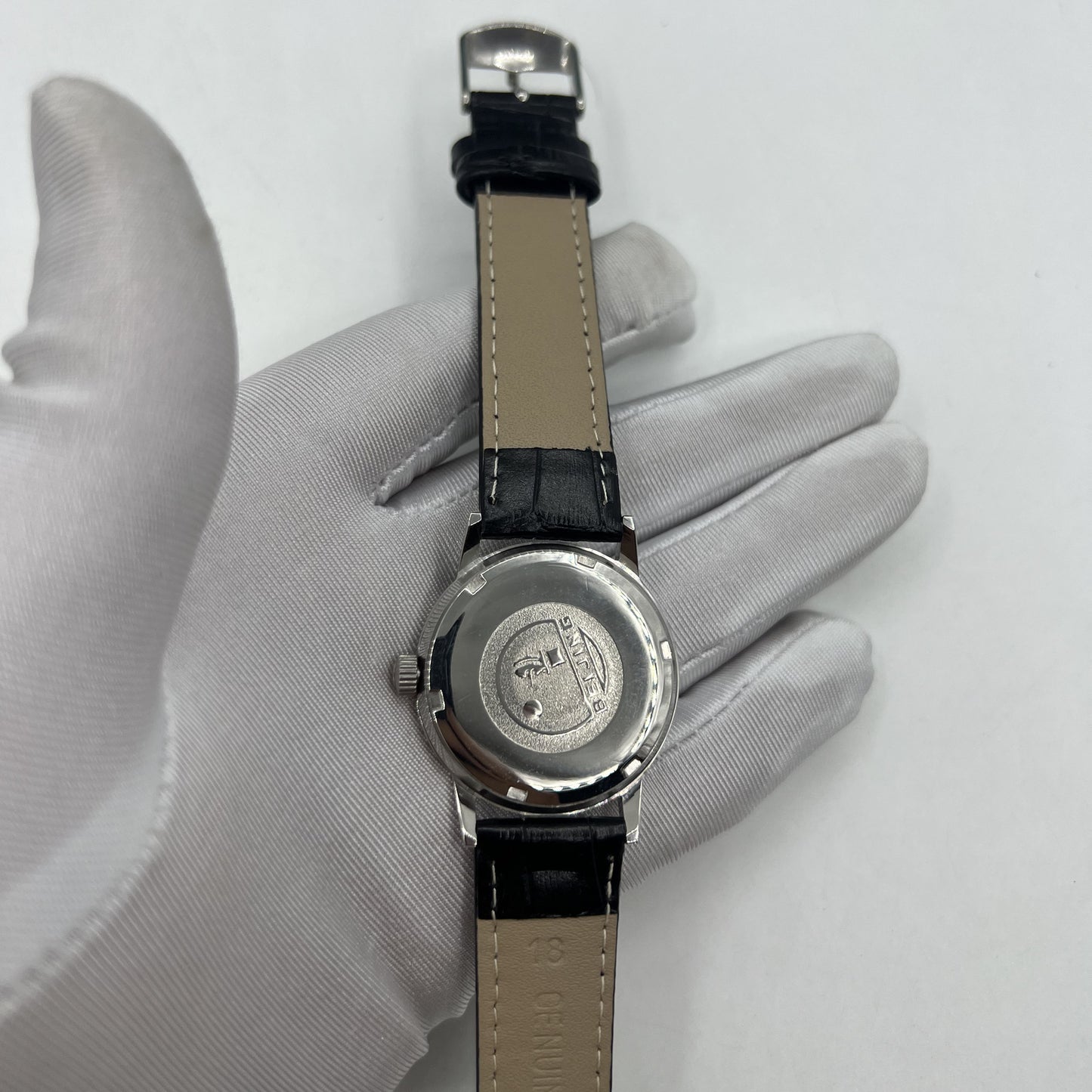 Beijing 36mm Double Rhomb silver watch with manual movement and sleek silver hour markers.
