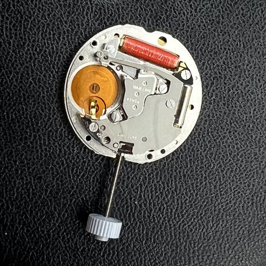 Swiss Made Ronda 784 quartz watch movement with date at 3 o'clock for accurate timekeeping.