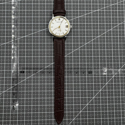 Shanghai 33mm manual mechanical watch with single calendar, 17 jewels, shock-resistant design for daily wear.