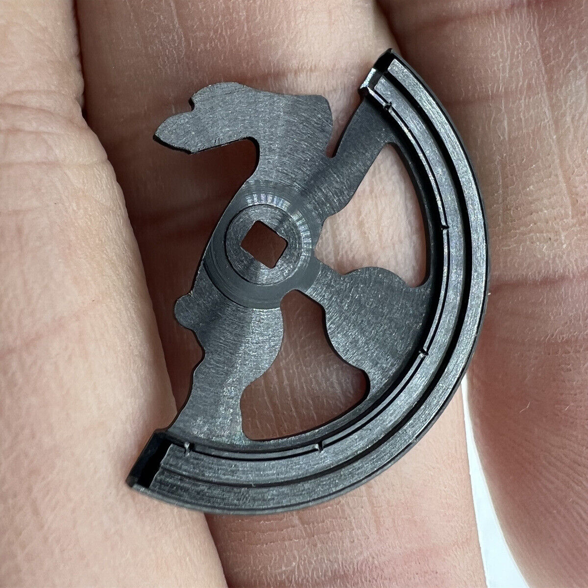 Black hollow rabbit rotor oscillating weight by Miyota for 8215 watch movement precision and style.