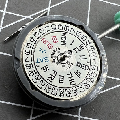 NH06A watch movement showcasing double calendar date at 3 o'clock, precision Japan-made mechanism.