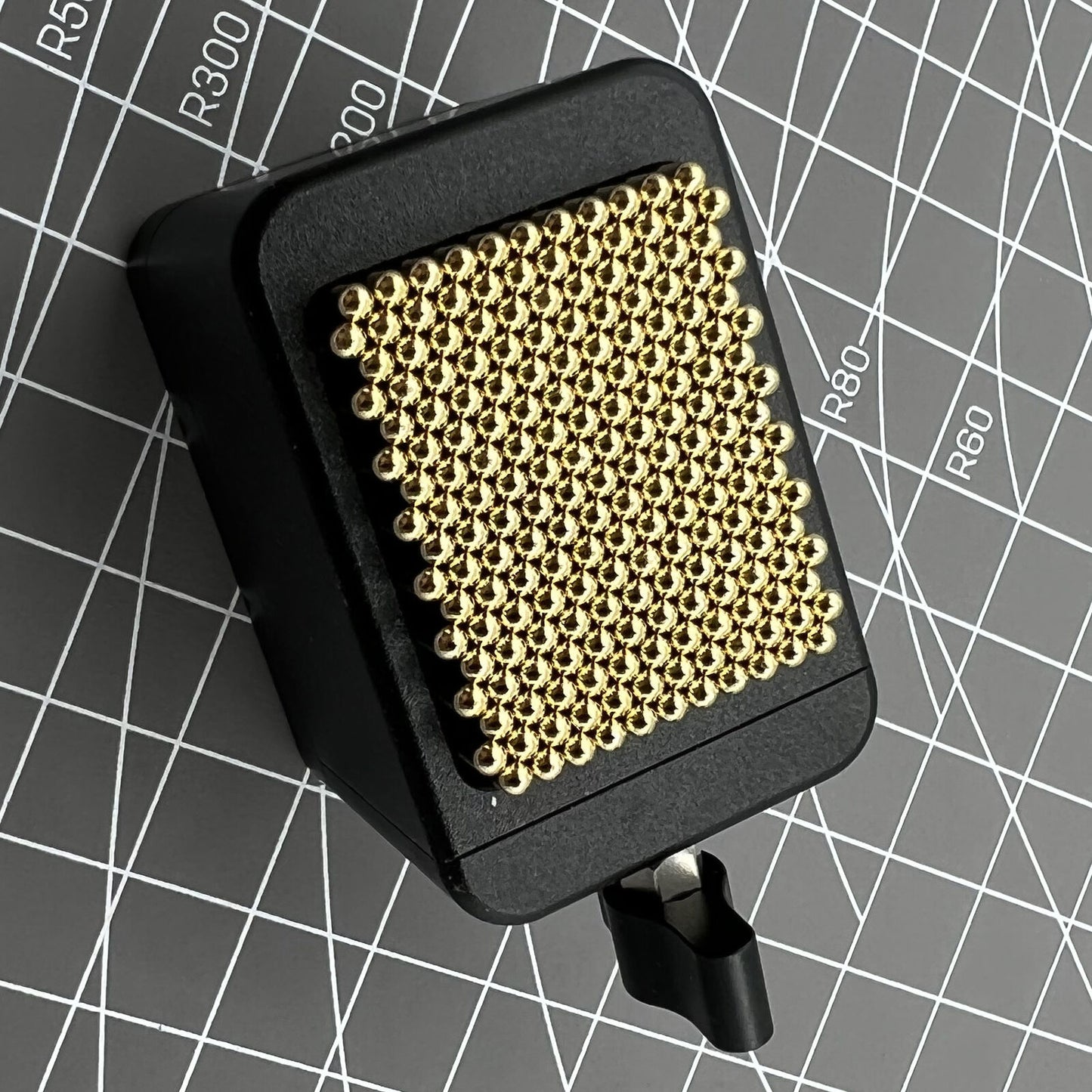 Universal China metal beads movement holder securely fits various watch movement shapes for precise repair.