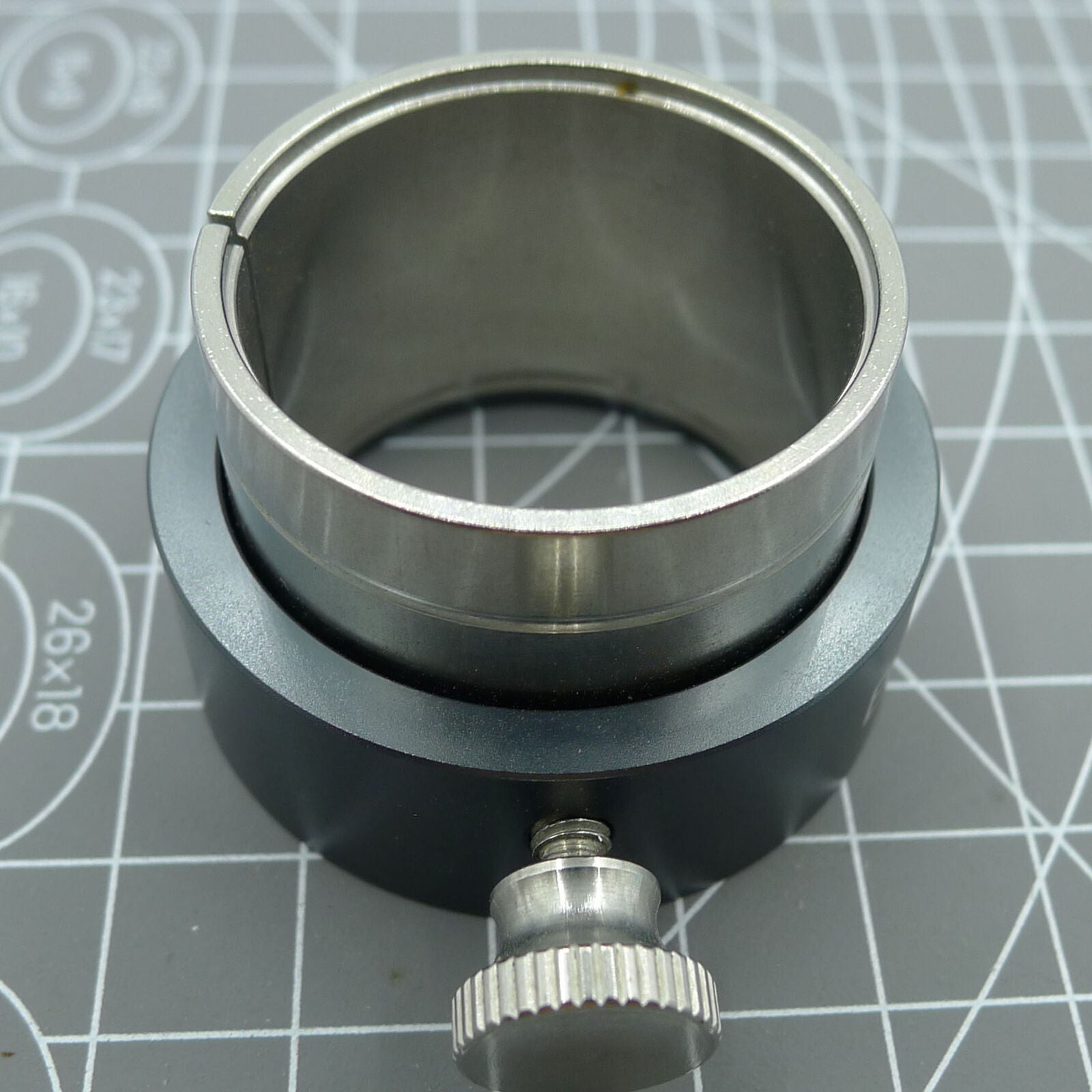 Reversible ETA 7750/7751 movement holder with knob for precise watch repairs.