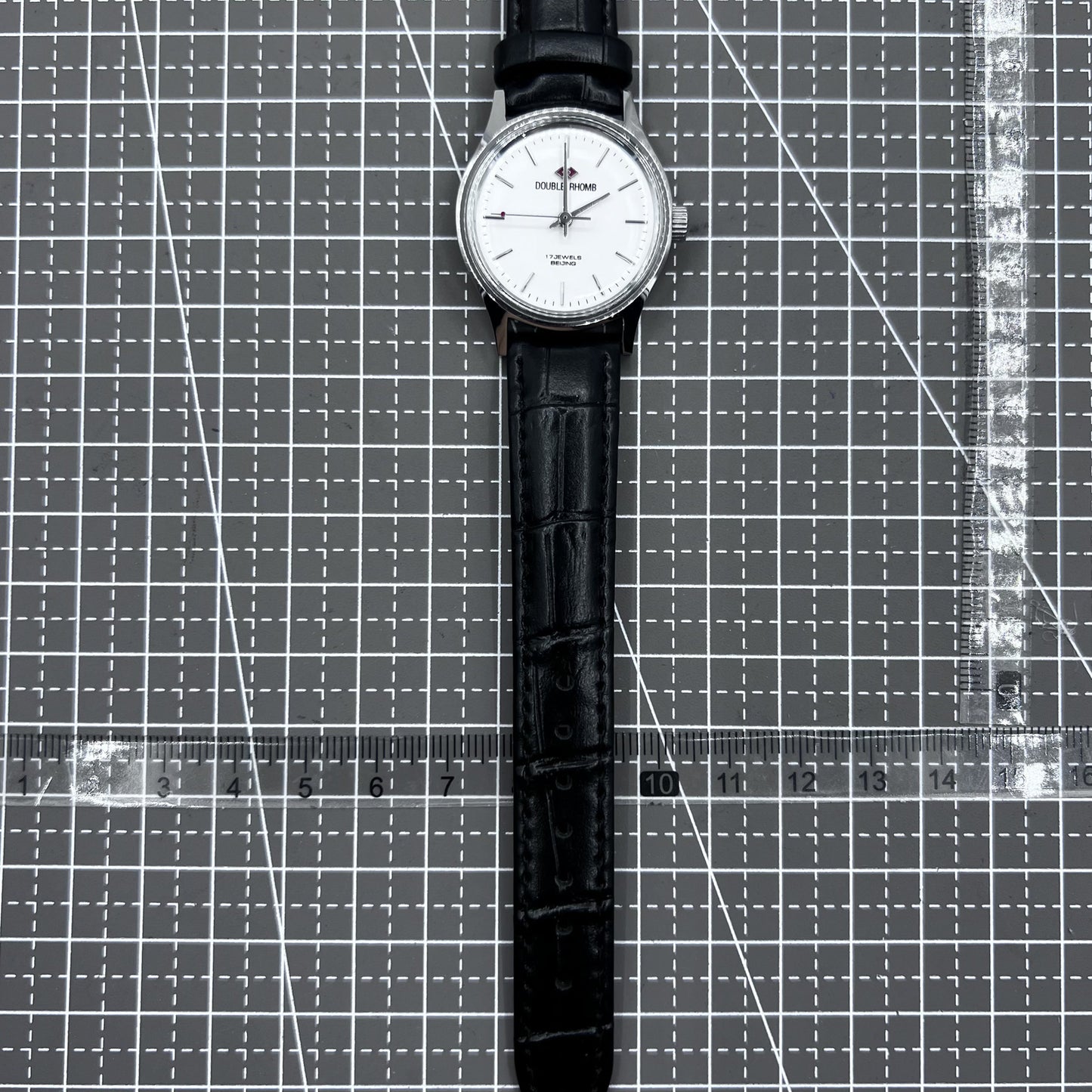 Beijing 31mm mechanical watch with silver case, black double rhomb strap, and classic three-hand design.
