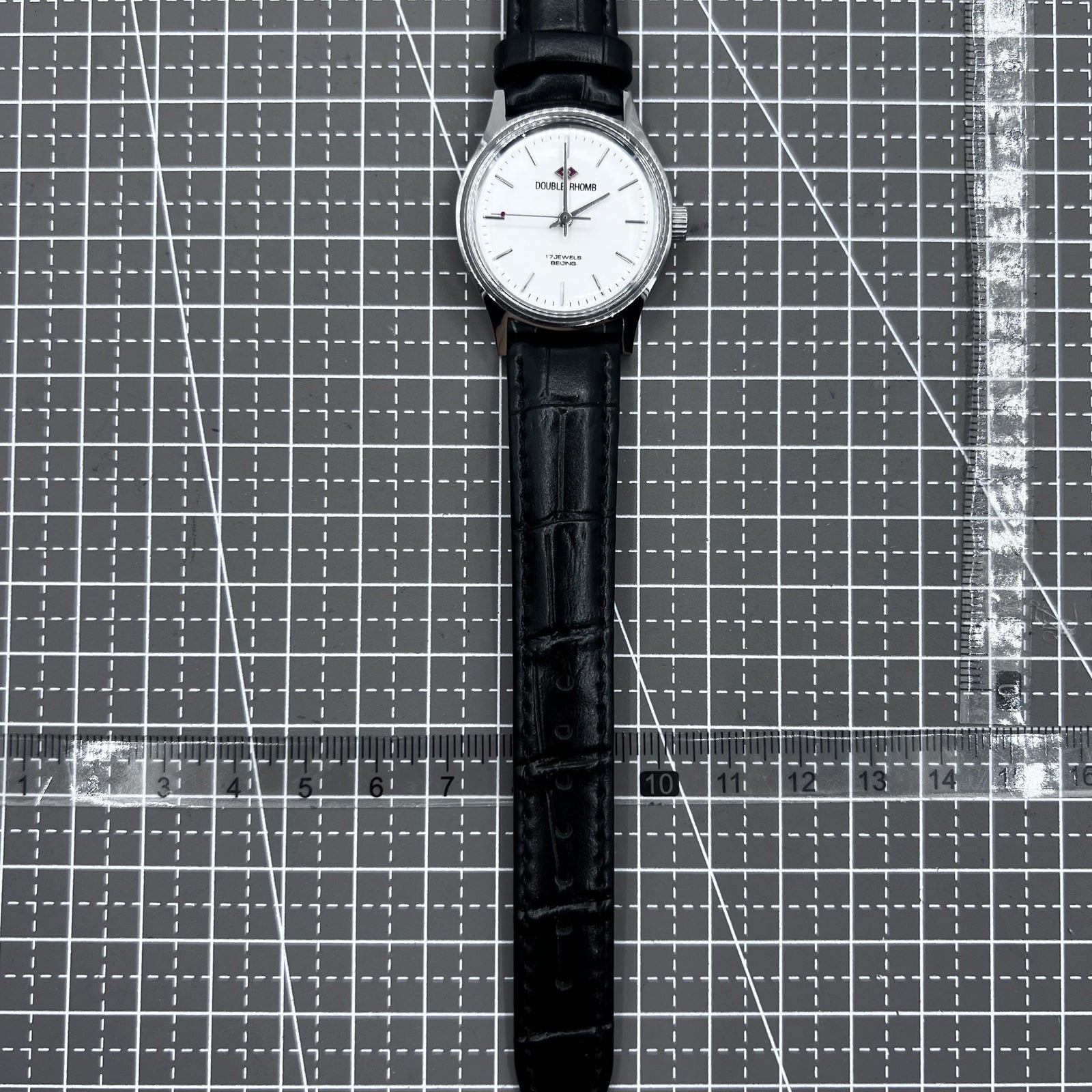 Beijing 31mm mechanical watch with silver case, black double rhomb strap, and classic three-hand design.